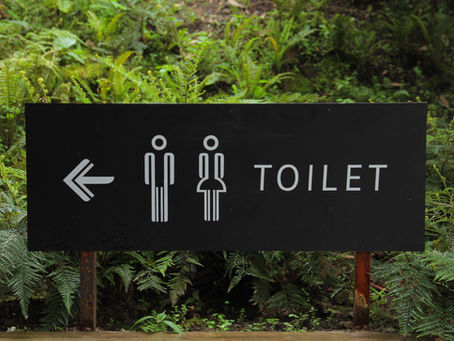 a sign for the bathroom.