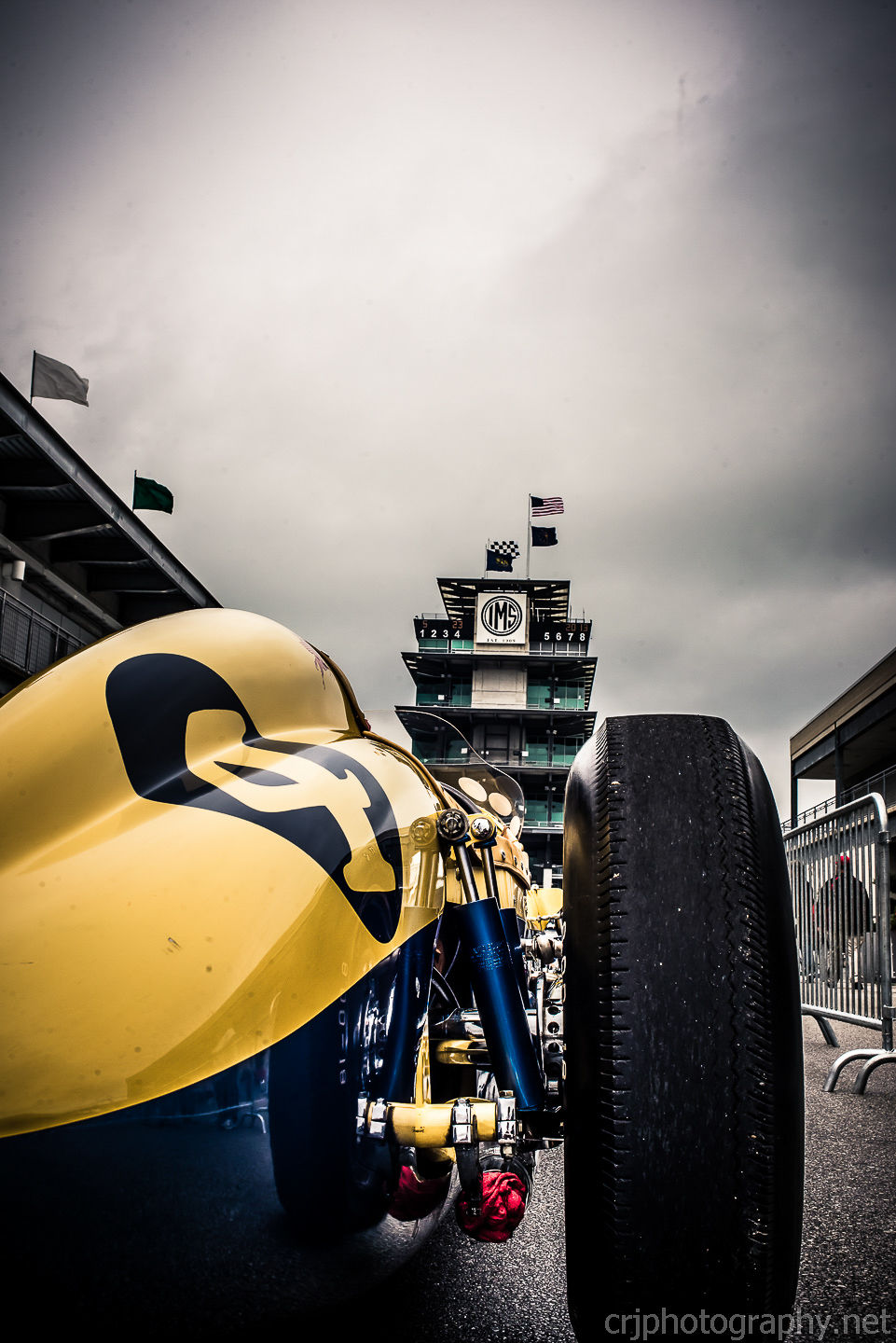 a yellow race car with the number 2 on it