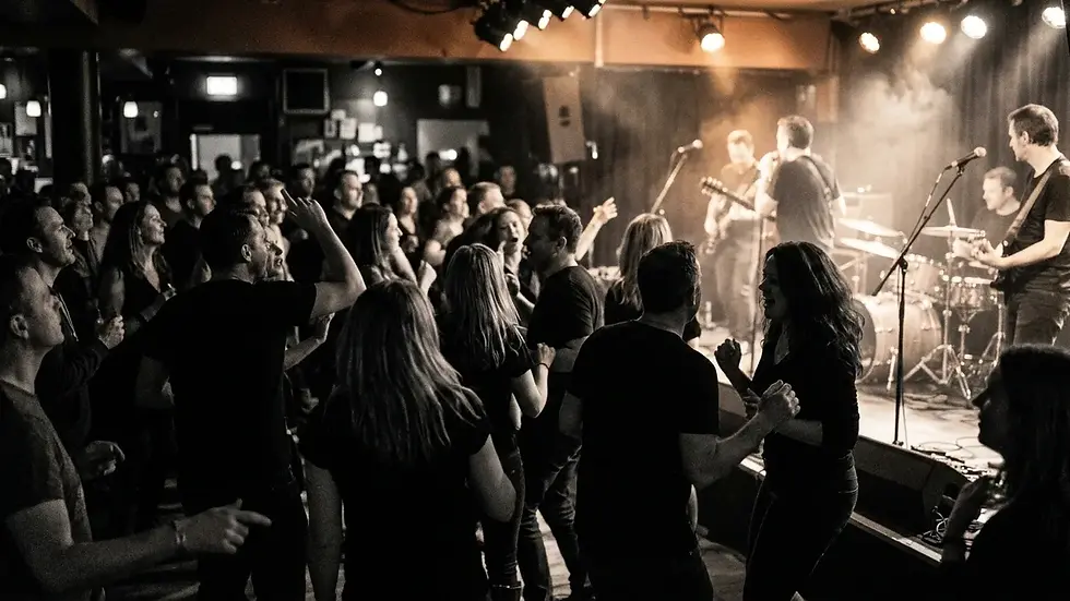 Guests dancing to a live band at a 40th birthday party