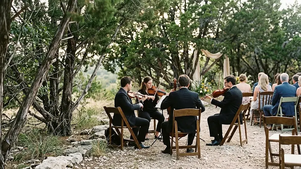 String quartet playing wedding prelude songs at outdoor Texas Hill Country ceremony