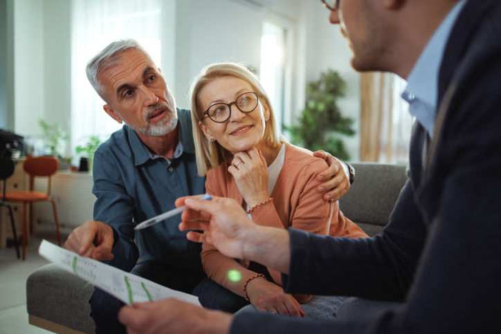 Couple get qcd advice from financial advisor.jpg
