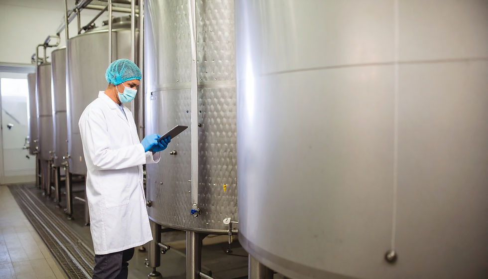 Firefly_Pharmaceutical production plant interior, with large stainless steel tanks aligned