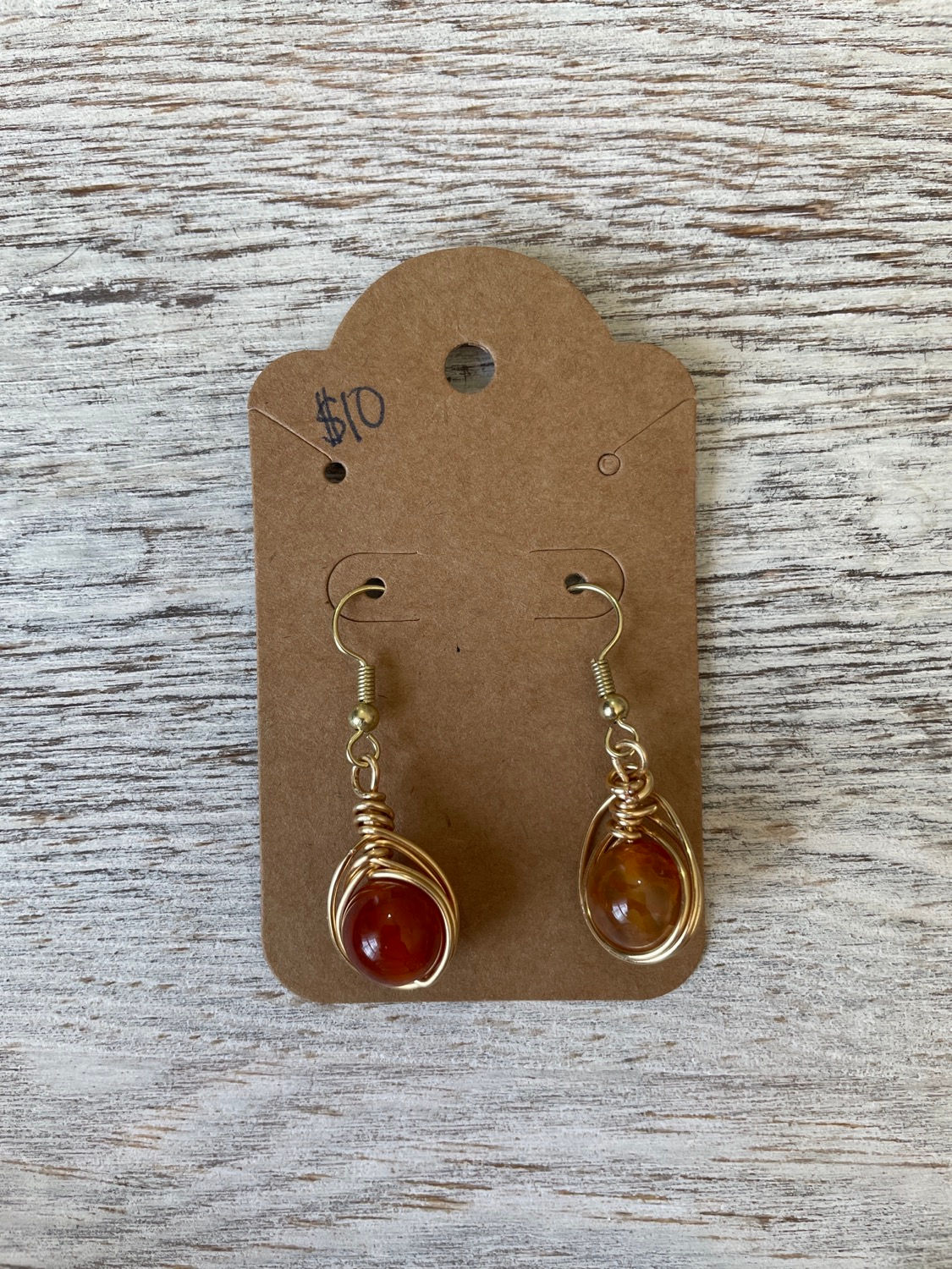 Gold wrapped burnt orange stone