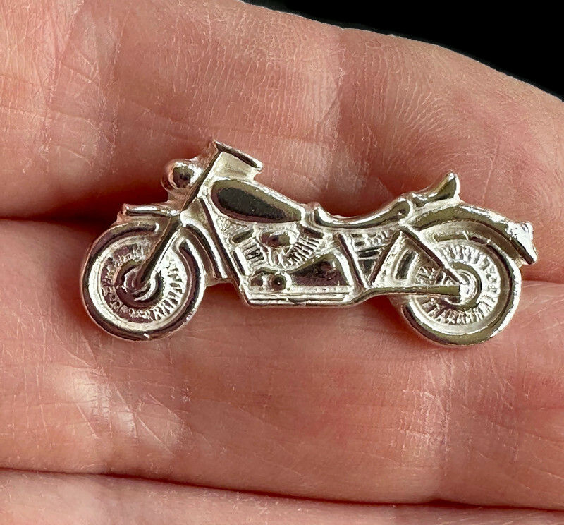 Thumbnail: Fine silver motorcycle brooch in hand to show size