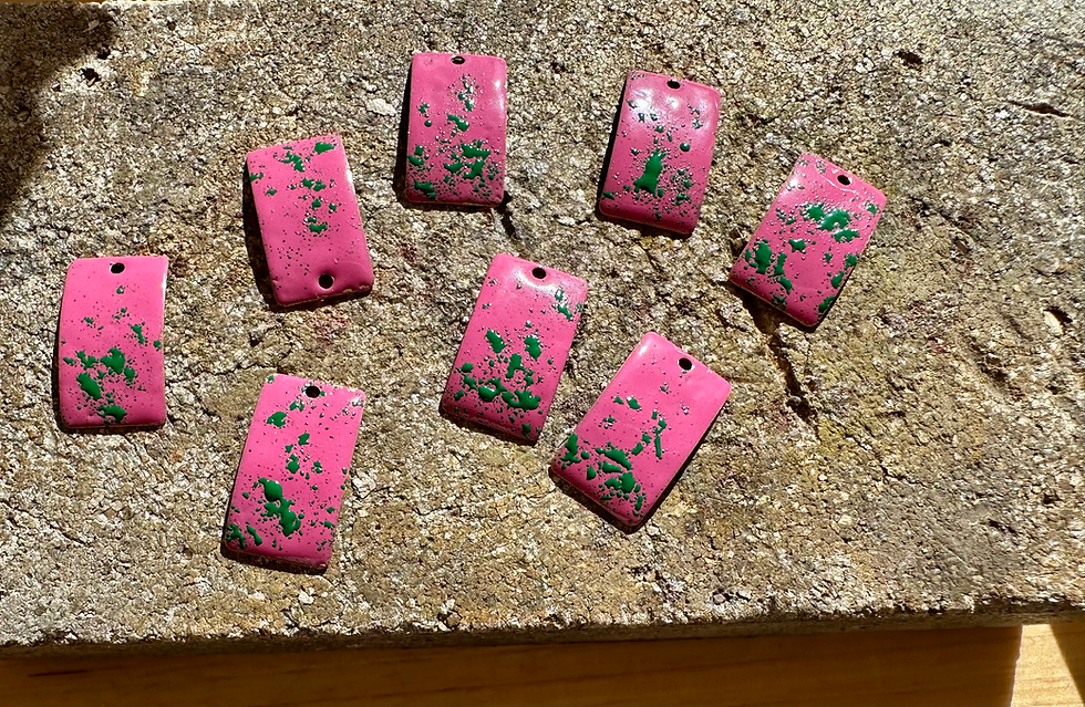 Thumbnail: pink earrings on work bench being made.