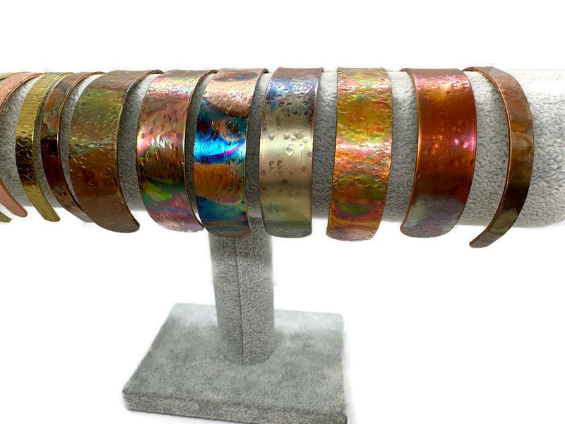 Thumbnail: heat treated copper bangles on stand