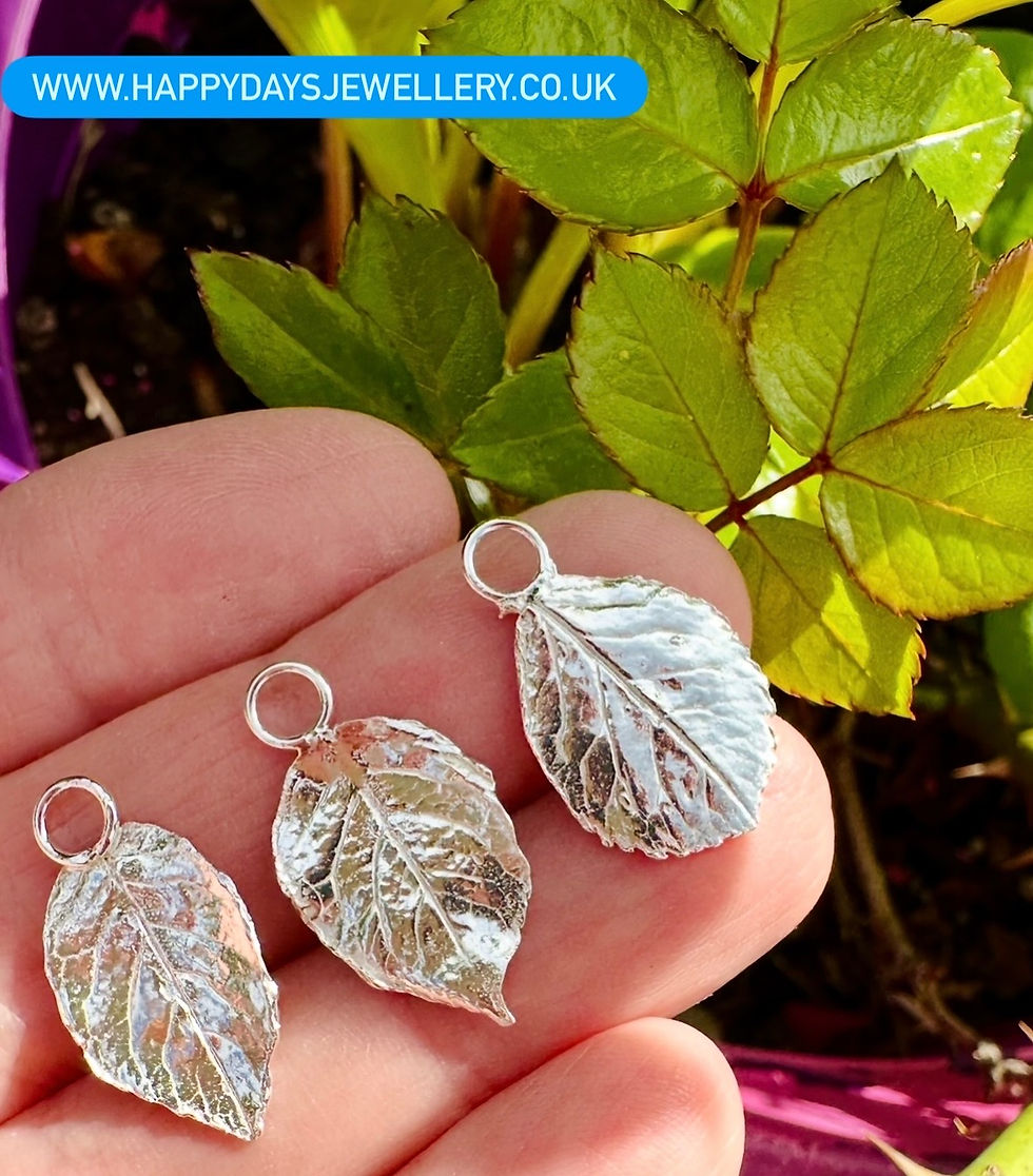 Thumbnail: Real rose leaves made from fine silver next to rose bush www.happydaysjewellery.co.uk