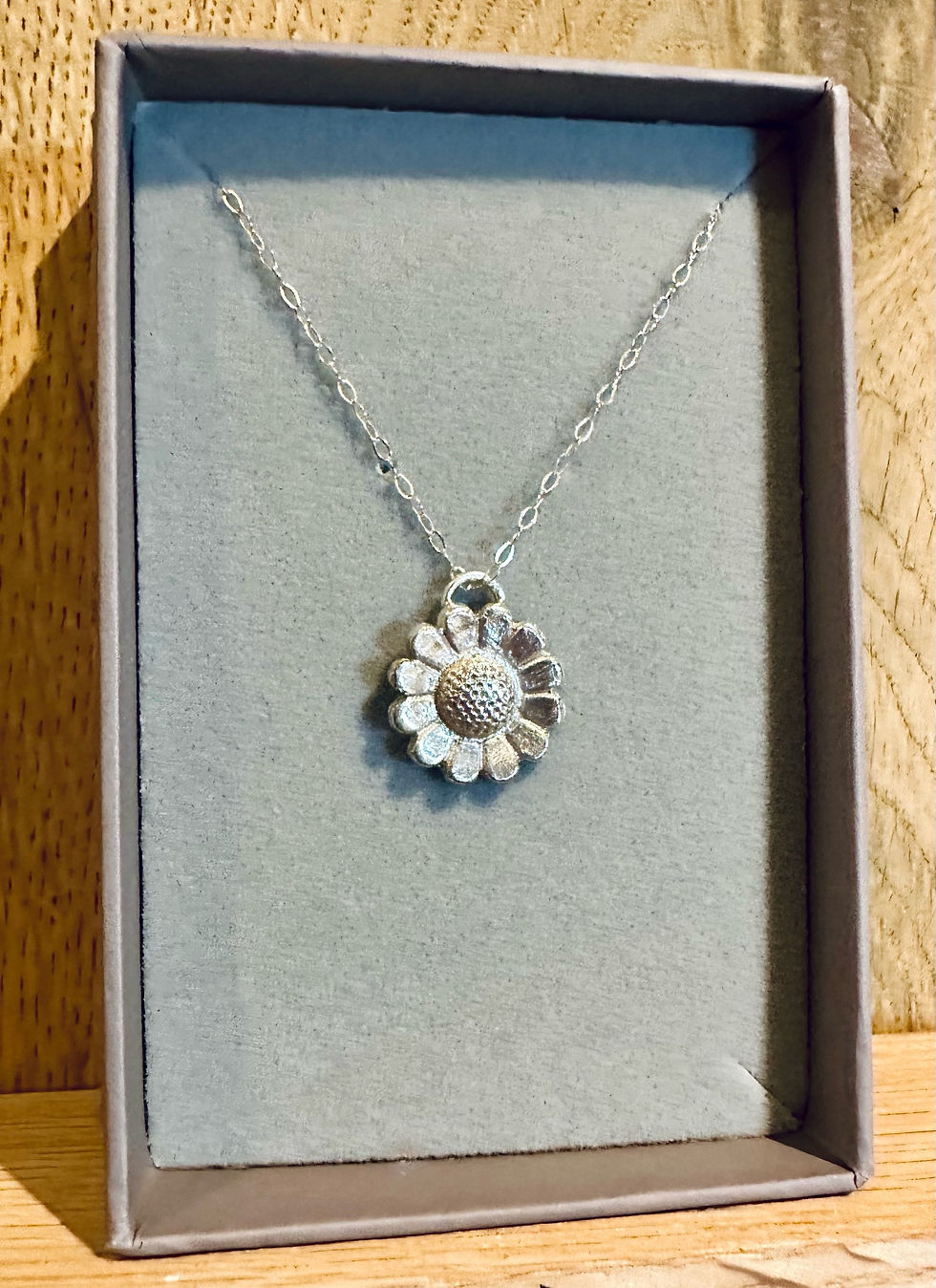 daisy necklace in box front view