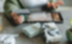A women shopping on her tablet for holiday gifts.