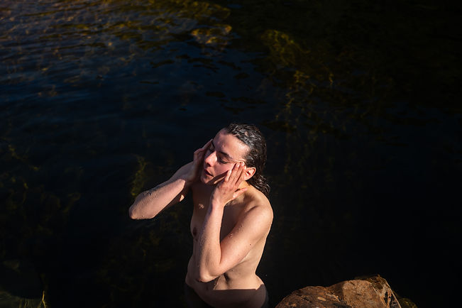 artistic image of women in golden sunlight by and in a river in scotland 