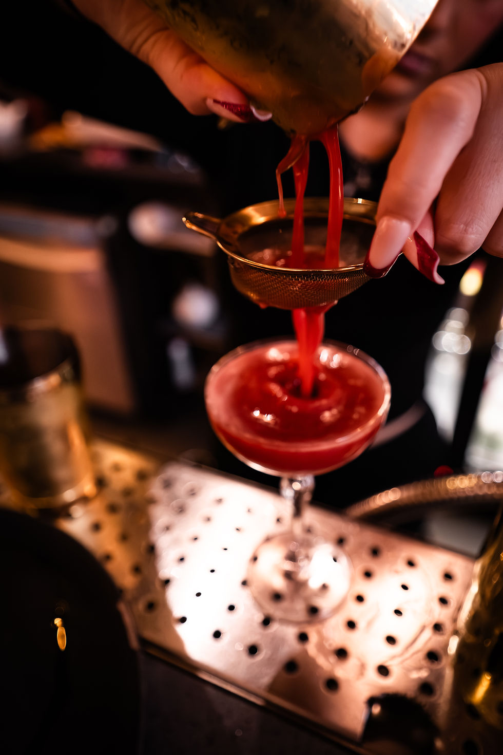 Eye-level view of a stylish cocktail bar interior with ambient lighting