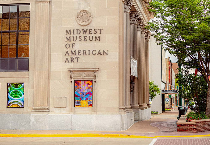 Exterior view of the Midwest Museum of American art with trees on a sunny day in downtown Elkhart