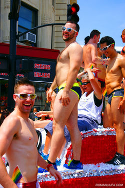 Men smiling and celebrating on a float during the Chicago Pride Parade