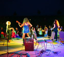 BETTY band performing on stage at night at Lake County PrideFest