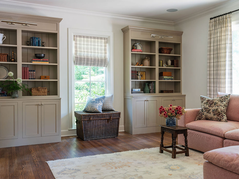 interior designer for a luxury home renovation- english inspired built-in bookshelves and pink sectional sofa