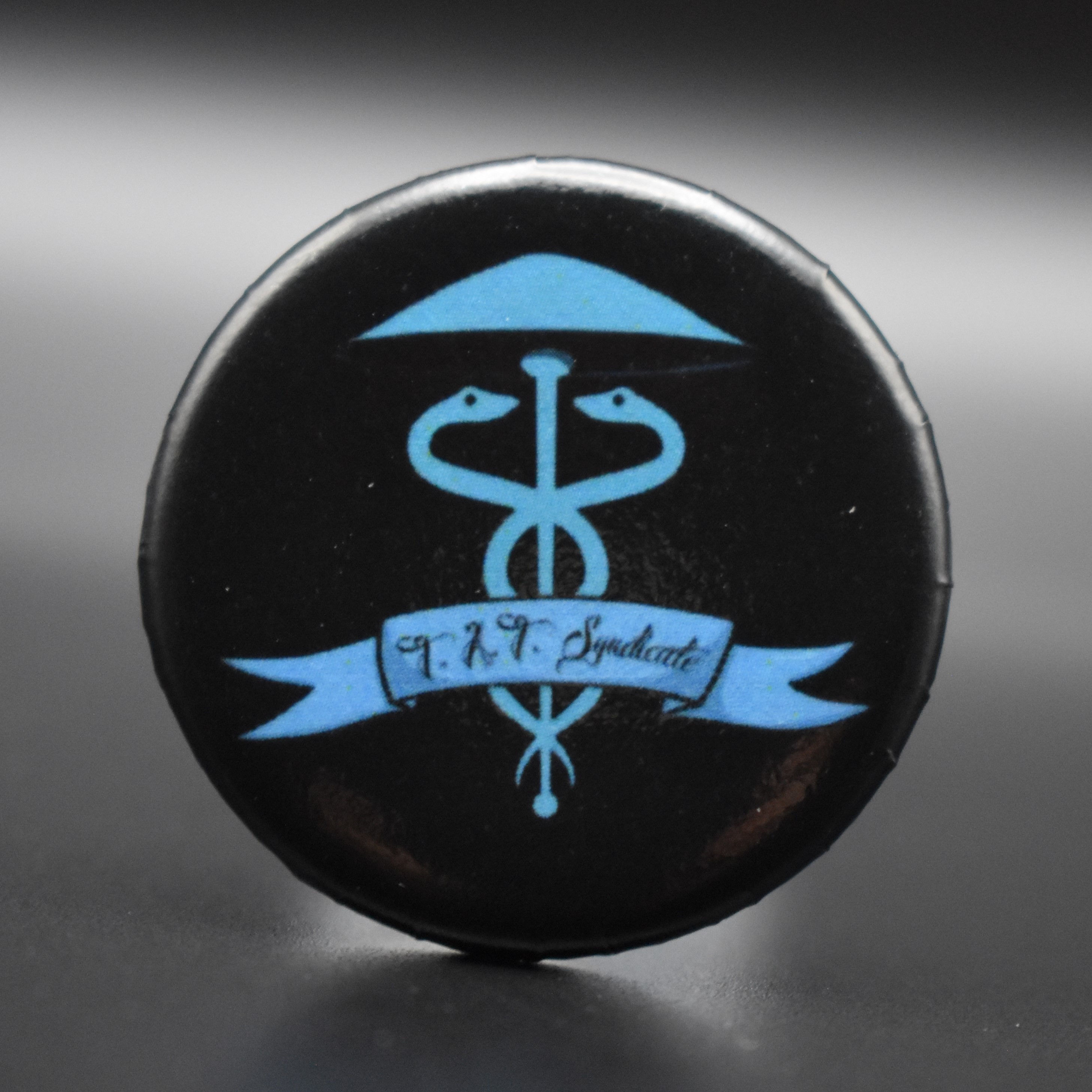 TAT Syndicate 1.5" Pin