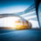 a truck driving down a bridge