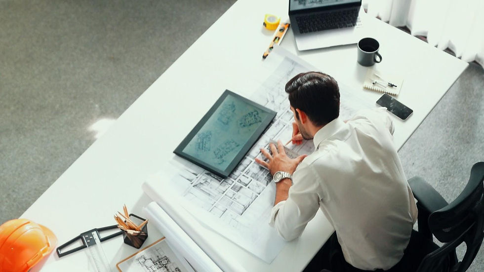 relaxed-smart-civil-engineer-lie-chair-table-with-blueprint-alimentation (1).jpg