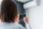 rear-view-woman-that-is-indoors-controlling-smart-home-technology (1).jpg