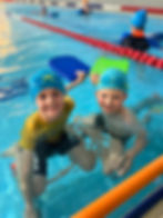 Starfish students smiling during learn to swim class
