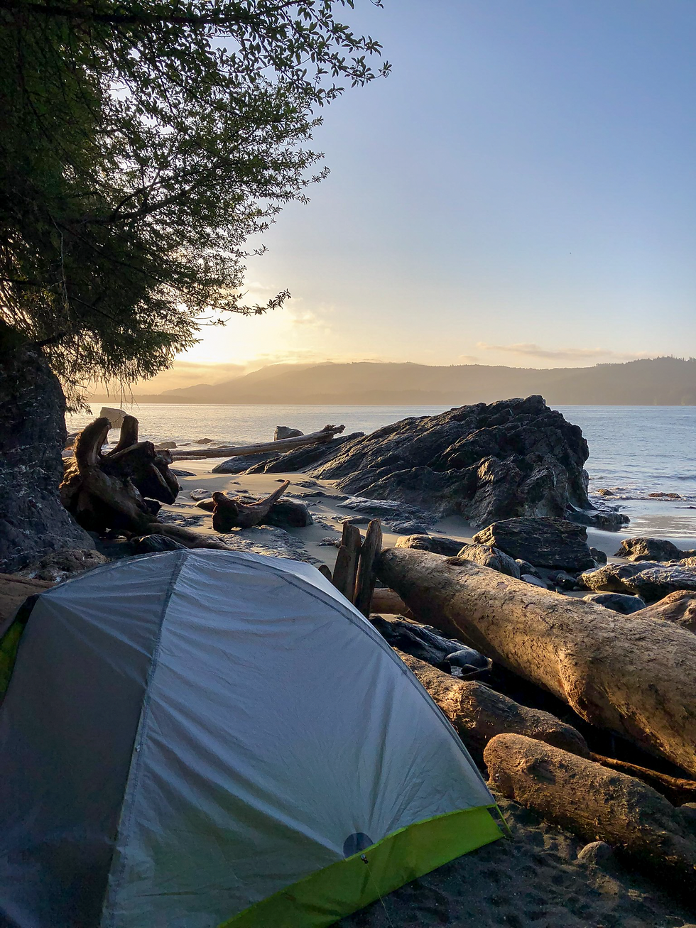 A tent at sunrise on a beach
