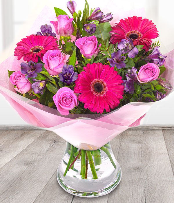 Roses gerberas and alstromeria cerise and purple