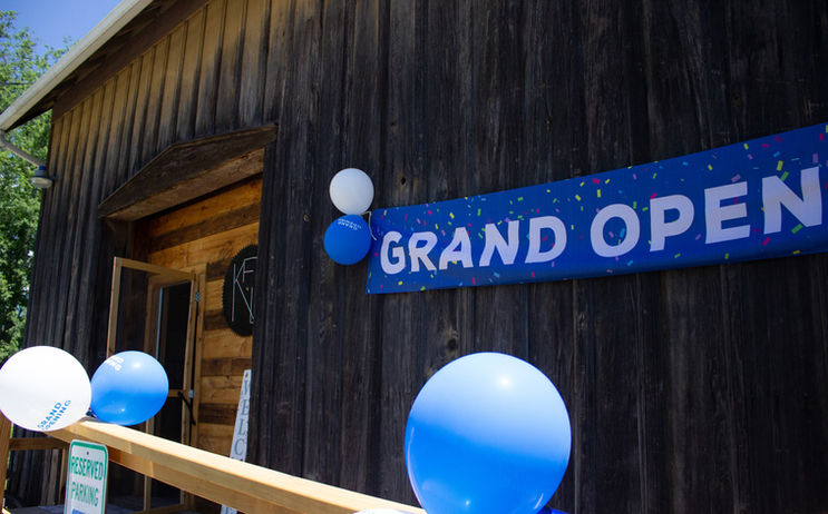 Grand Opening banner and balloons outside the Keir Family Distillery tasting room