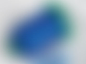 Blue Isacord thread spool on white fabric embroidered with "Capri Construction" in blue.