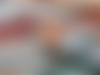 Fiskars Rotary Cutter on striped fabric. The fabric features blue, orange, and white stripes.