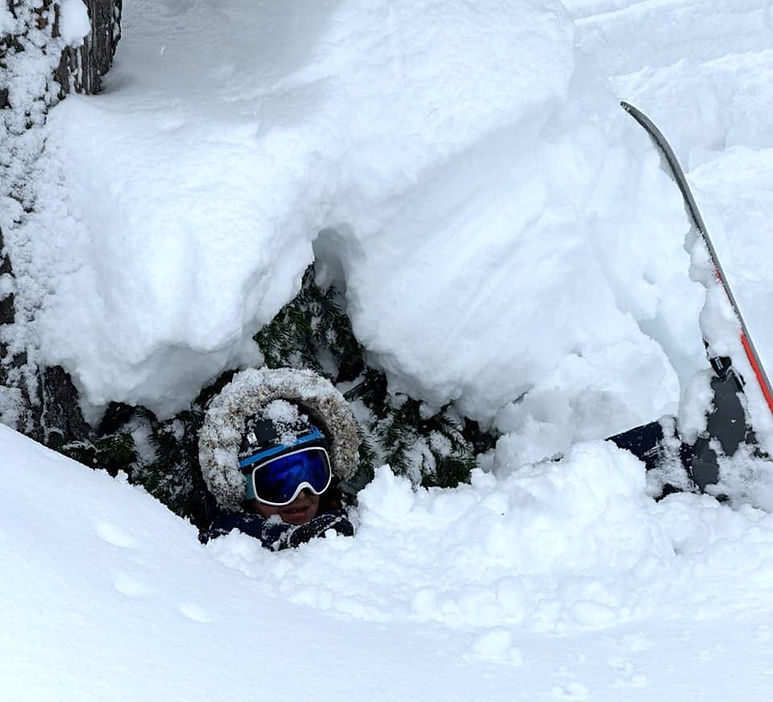 A young skier caught in a tree well (photo by Shahram Afrasiabi)