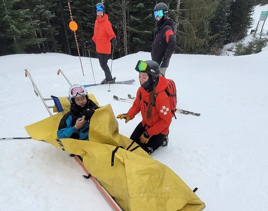Cliff Loh being rescued by the Whistler Blackcomb Ski Patrol
