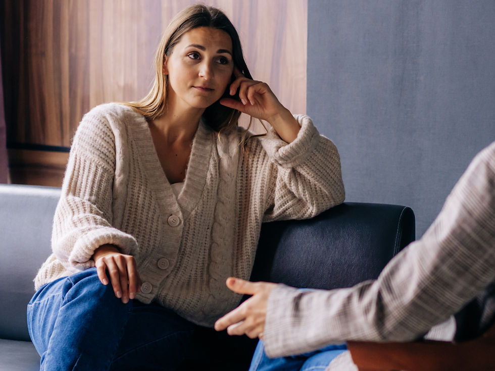 A woman speaking to her therapist about her birth experience / birth trauma / perinatal trauma 
