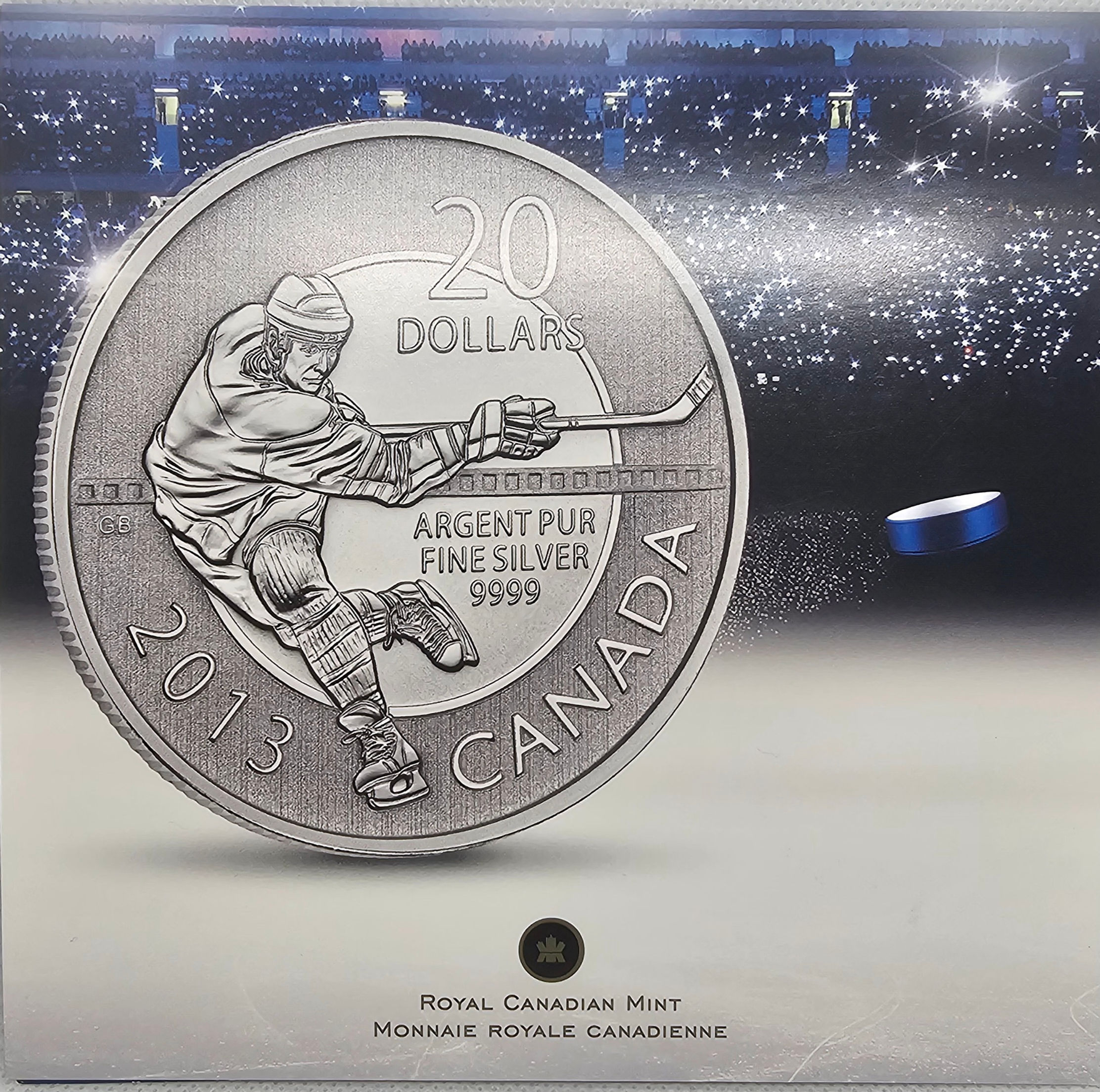 2013 Canada $20 for $20 Fine Silver Hockey Coin reverse featuring a hockey player in action, struck in 99.99% pure silver.