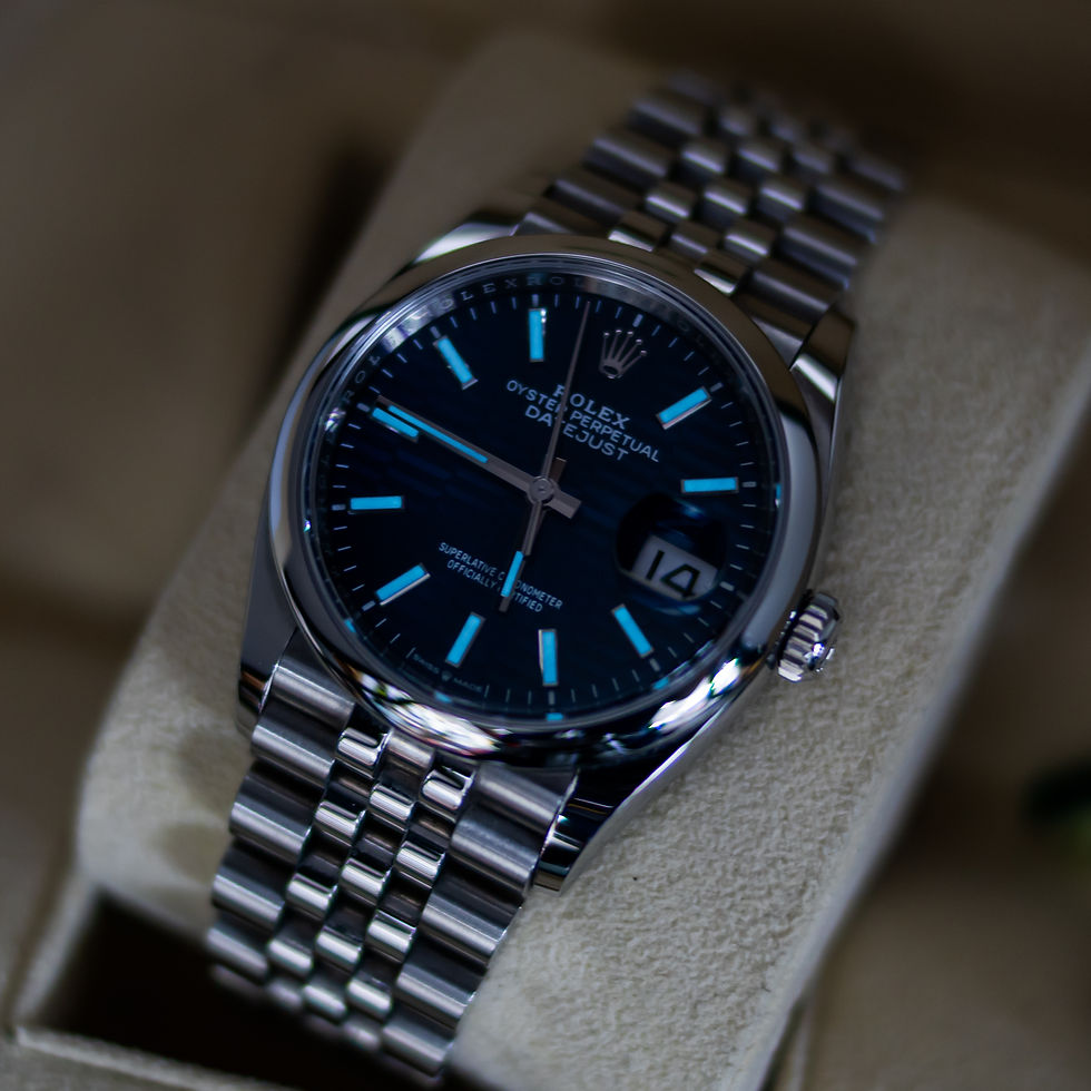 A shot of the Rolex Datejust in low lighting to highlight the "lume"