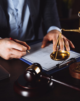lawyer-office-statue-justice-with-scales-lawyer-working-laptop_edited.jpg