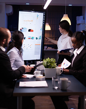 diverse-multi-ethnic-business-teamwork-overworking-office-meeting-room-analyzing-financial