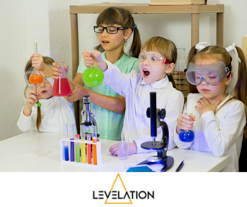 Women and girls in science - 4 young girls with test tubes and sample bottles filled with colourful liquids
