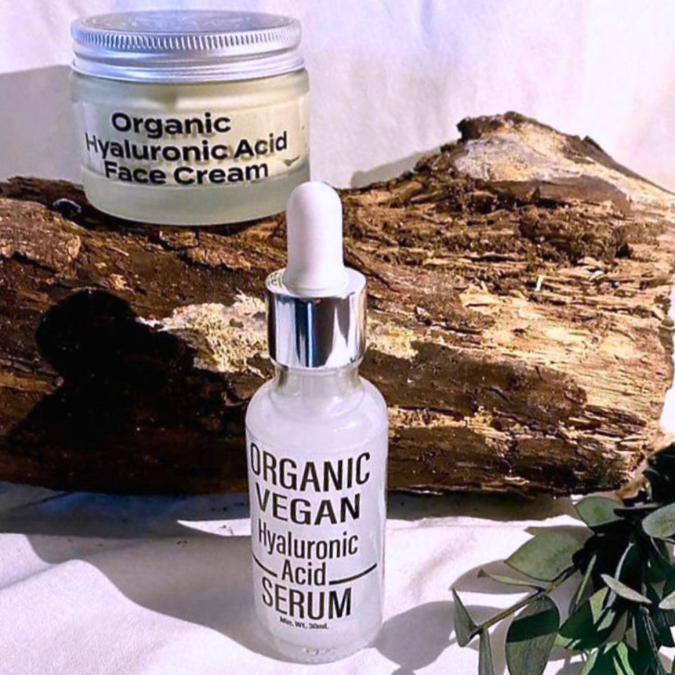 Totally natural skincare - Organic vegan hyaluronic acid serum and organic hyaluronic acid cream displayed on driftwood