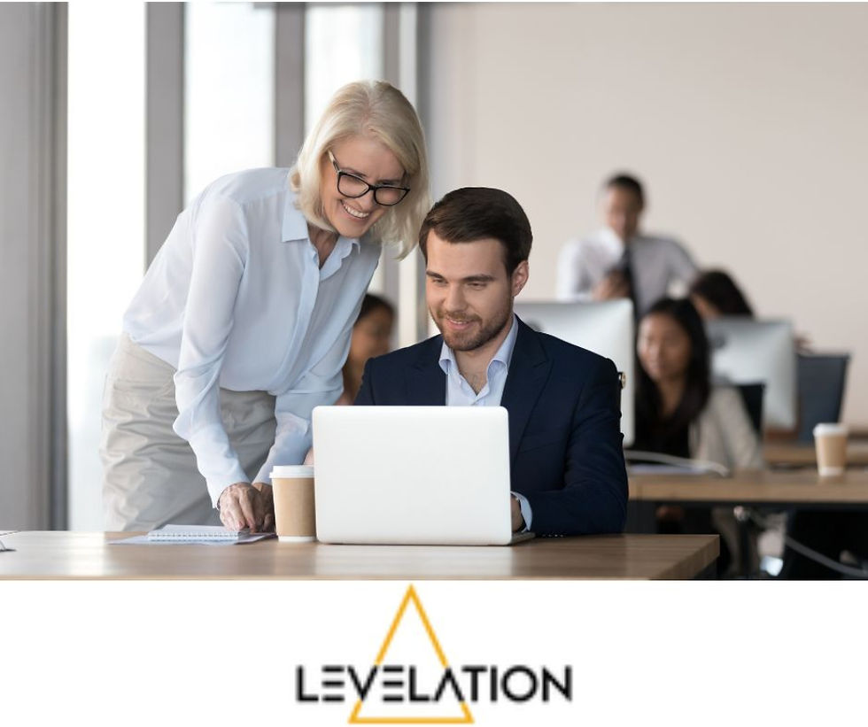 Growth of Apprenticeships a senior female is training a male in an office environment