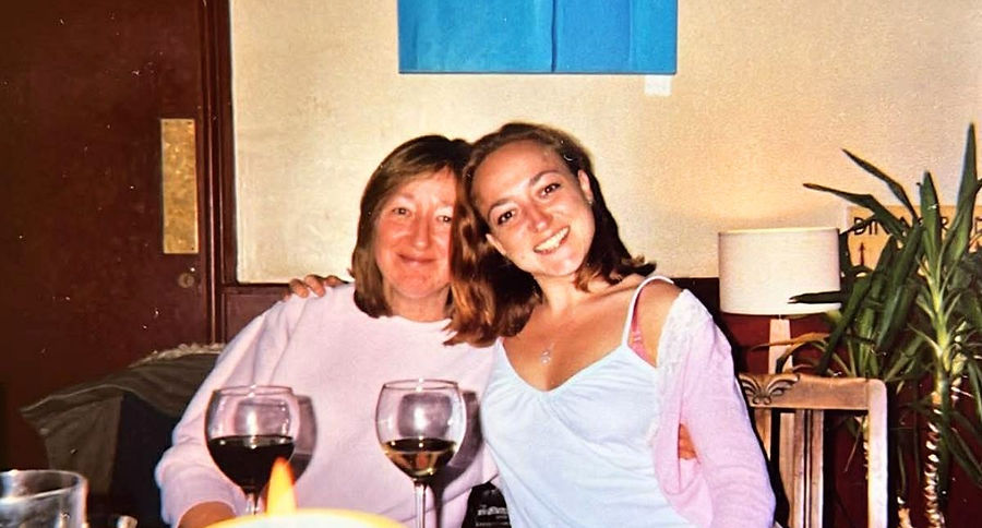 Meet Miriam and her lovely mum, sat at a restaraunt table huggin each other as the smile to the camera