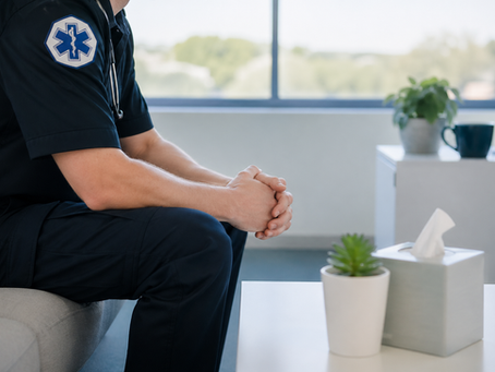 California EMT sitting in a counseling room after traumatic emergency response work related to a PTSD workers compensation claim