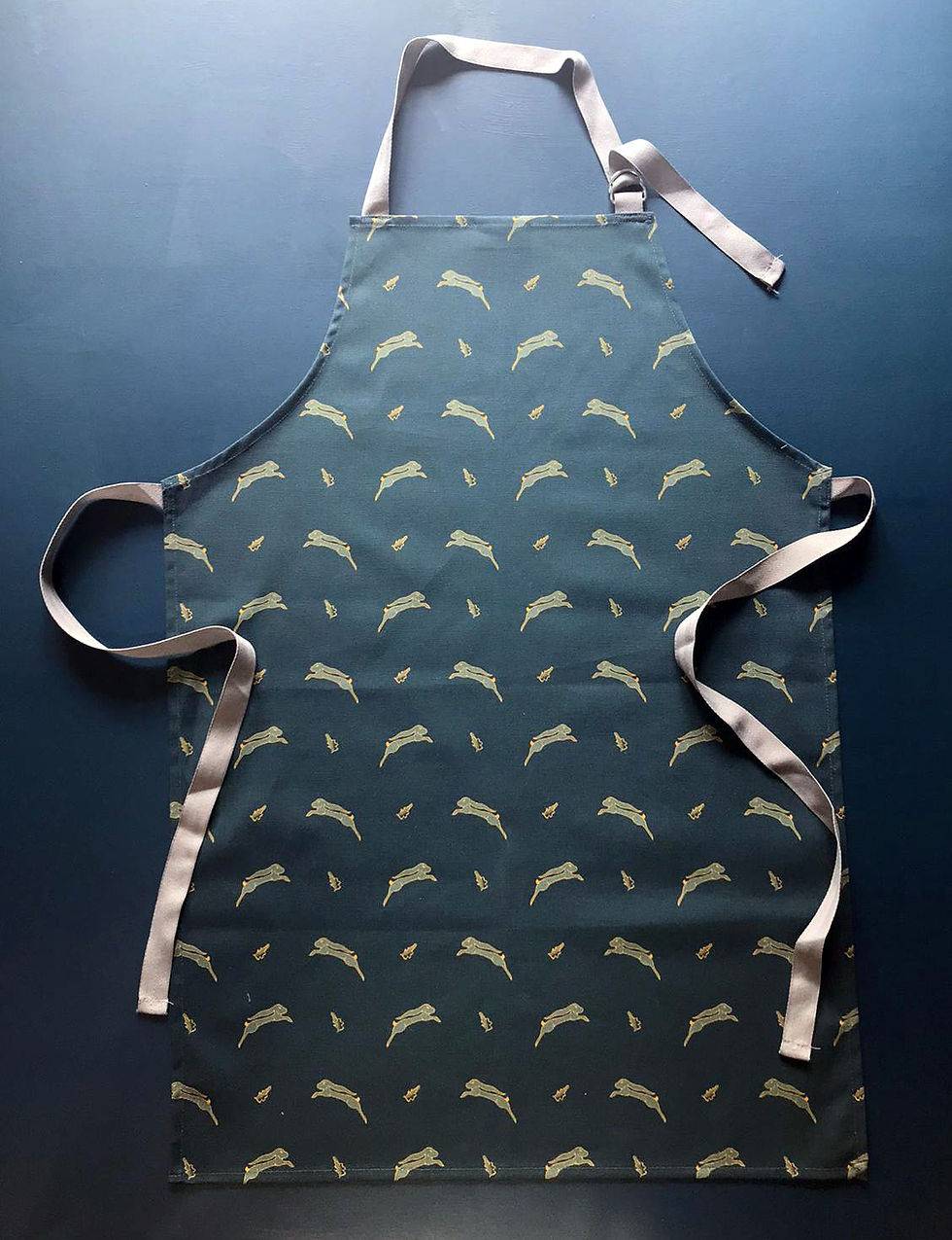 Whimsical Hare dark blue kitchen apron by Willis Bloom. Made in England.