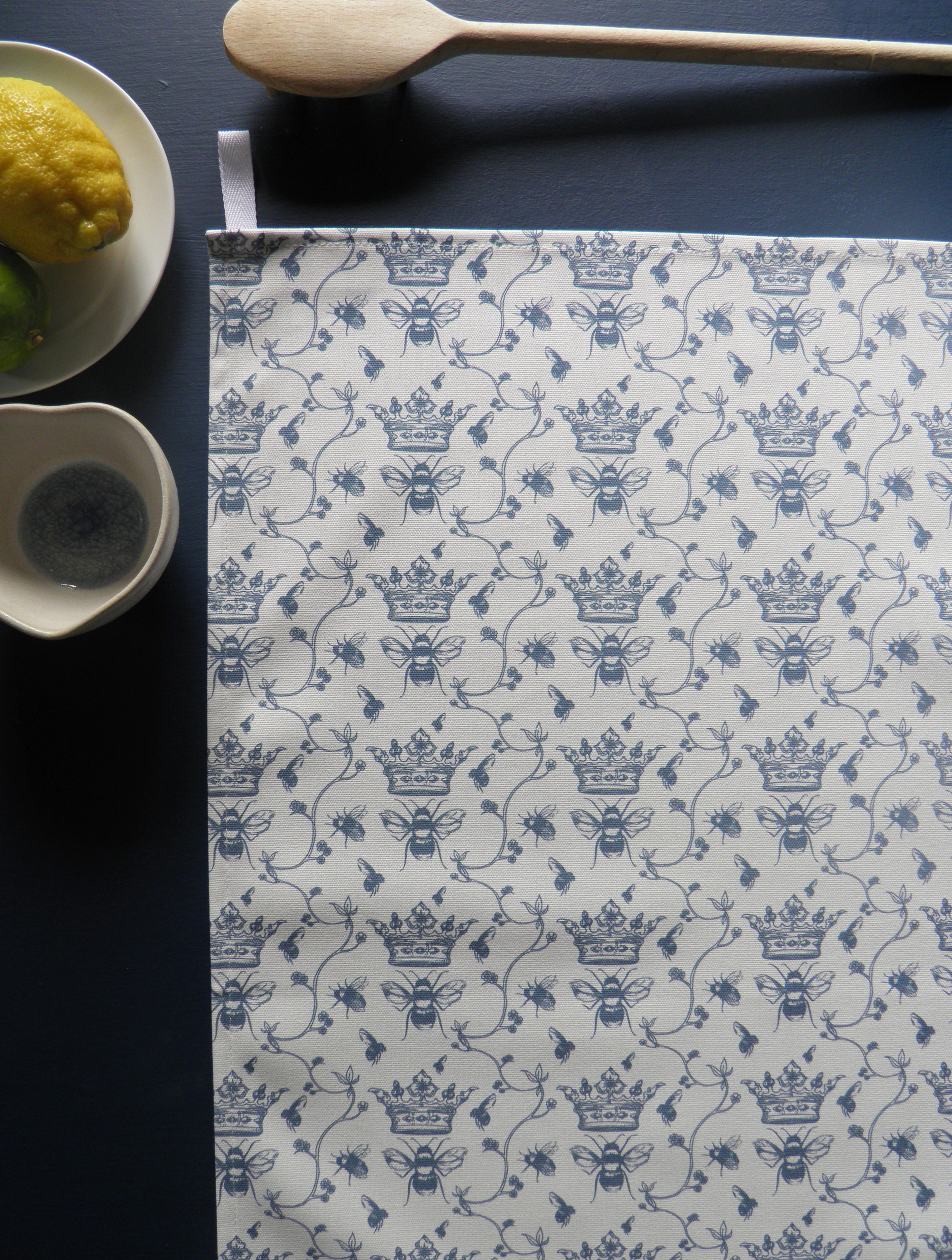 Beautiful floral bee tea towel, with a soft blue hand drawn design by Willis Bloom. Designed and made in Engalnd.