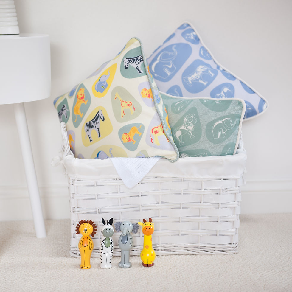 Thumbnail: Pebble safari cotton fabric collection shown in green, blue and multi colurways as cushions