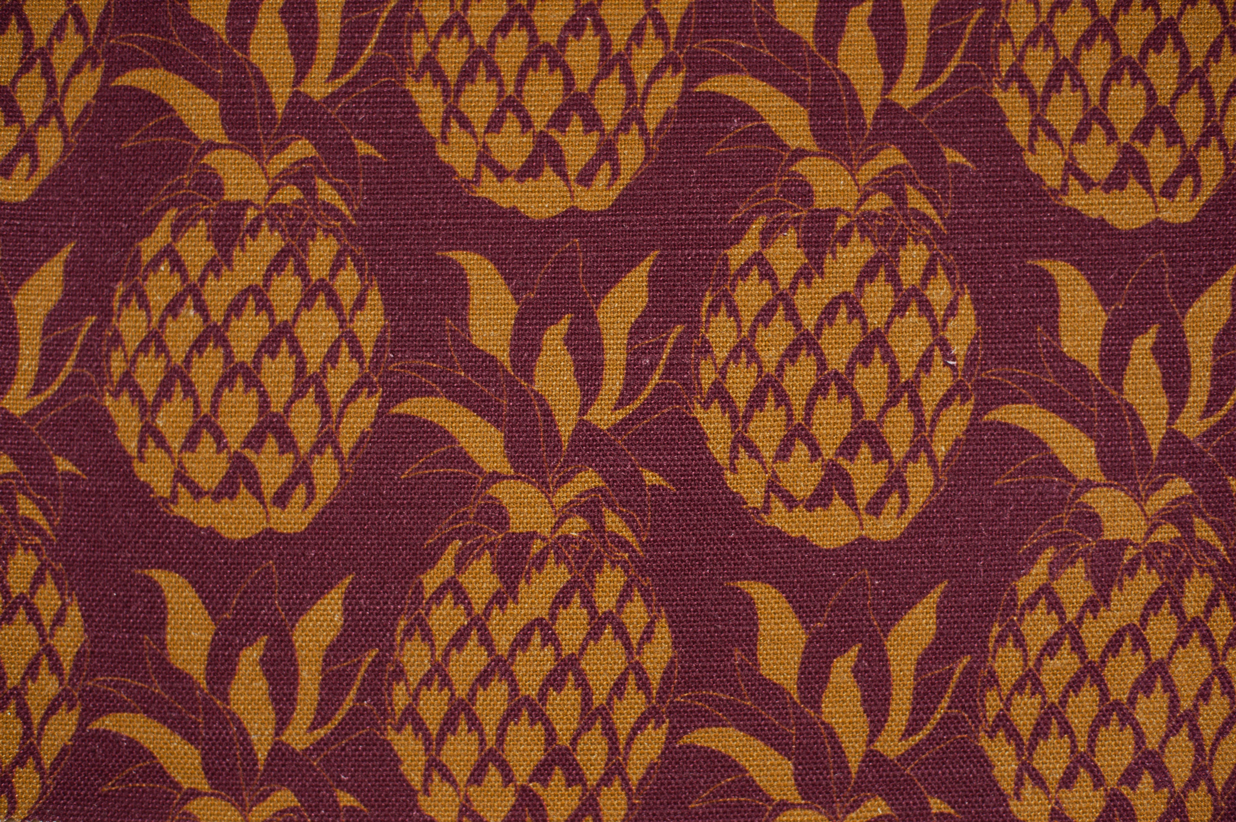 Willis Bloom Pineapple fabric in Garnet. A rich red and gold design for people that love pattern and beautiful homes.