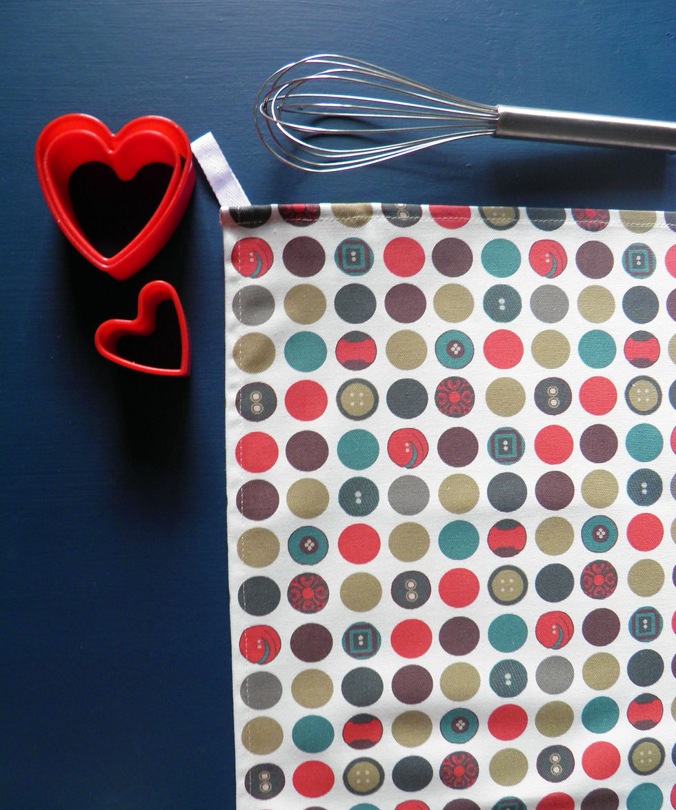 Dotty Tea Towel by Willis Bloom. Red, teal, blue dot for stylish beautiful homes and kitchens. Designed and made in England.
