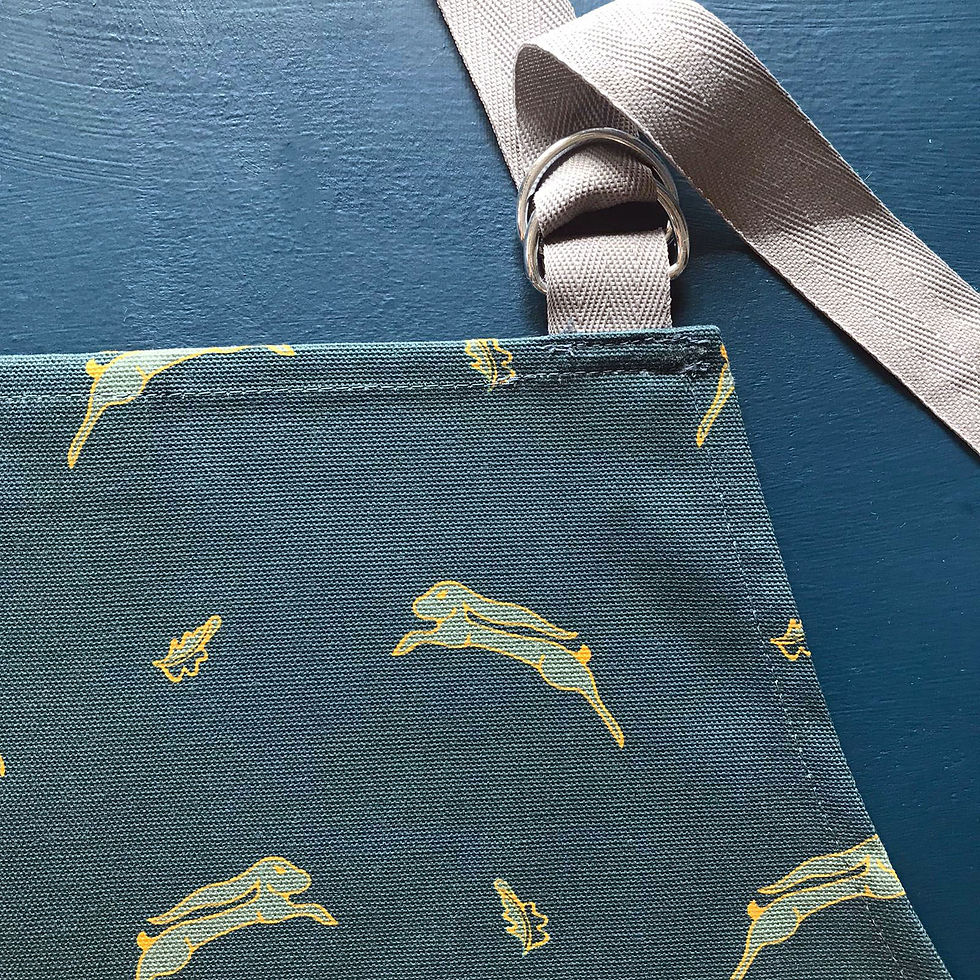Thumbnail: Whimsical Hare dark blue kitchen apron by Willis Bloom. Made in England.