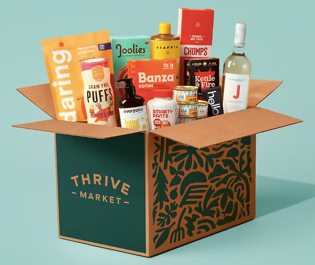 Shipping box with food and snacks coming out of it