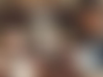 Woman holding a warm cup of tea in a sunlit, plant-filled home, practicing a mindful morning ritual focused on balance, wellness, and intentional self-care.