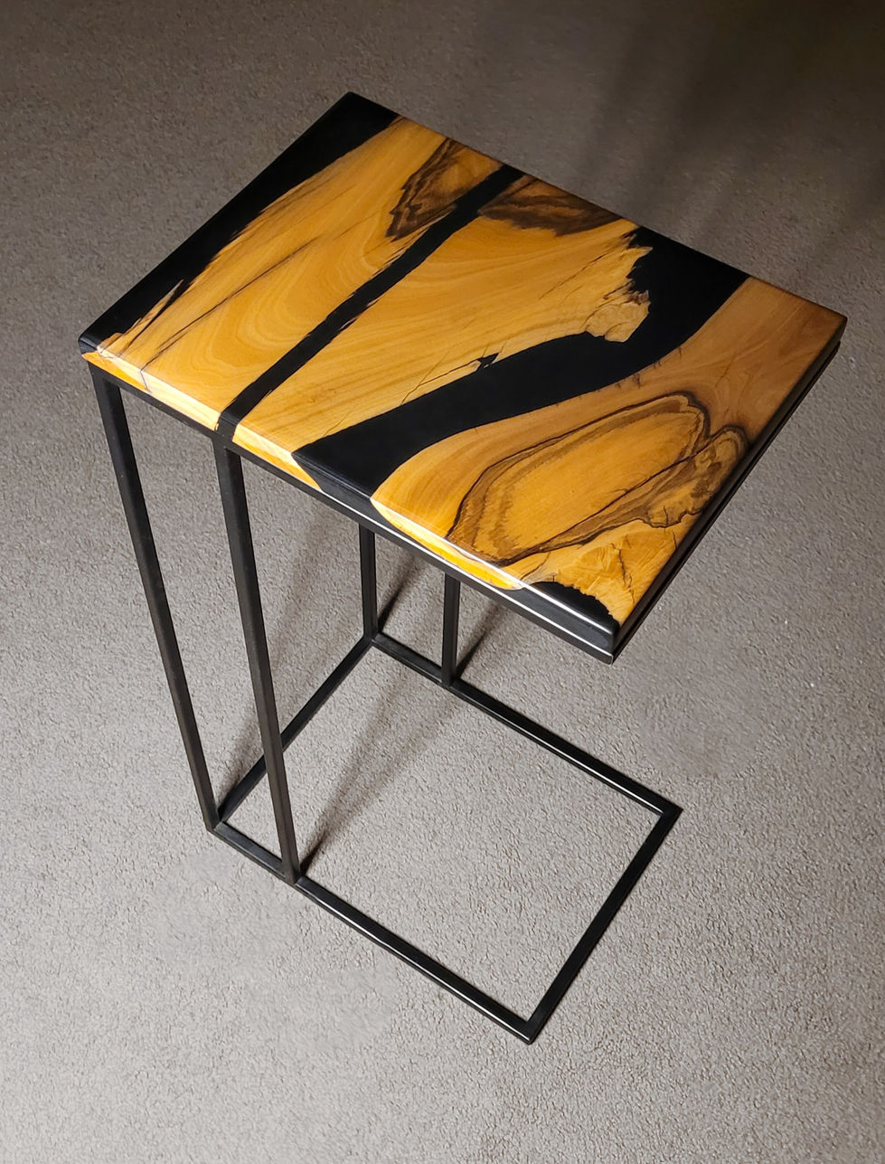 3D view of Resin and timber cantilever side table, to suite couch. Black powder coated metal legs